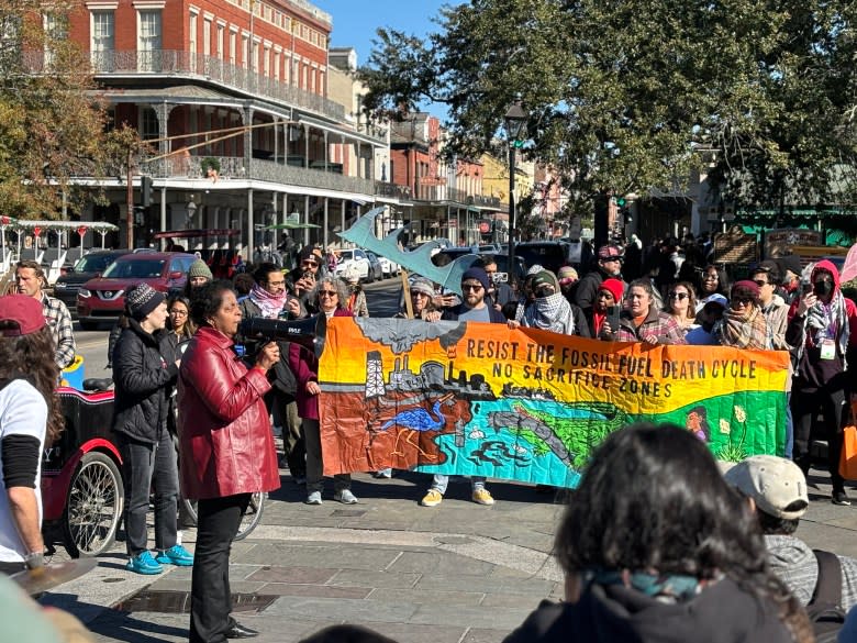 Activists demonstrate in New Orleans' French Quarter in opposition to Americas Energy Summit.