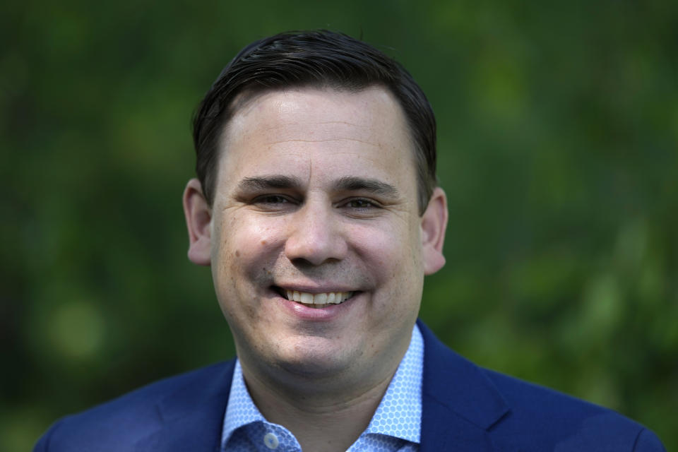 KCCI-TV chief meteorologist Chris Gloninger stands outside his home, Tuesday, June 27, 2023, in West Des Moines, Iowa. Gloninger has announced that he is leaving the Des Moines station due in part to threats he received for his coverage of climate change on air. (AP Photo/Charlie Neibergall)