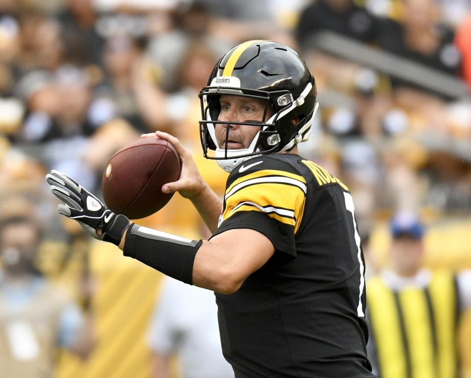 FILE - In this Aug. 25, 2018, file photo, Pittsburgh Steelers quarterback Ben Roethlisberger (7) passes in the first quarter of an NFL football game against the Tennessee Titans, in Pittsburgh. As long as Mike Tomlin is standing on the Pittsburgh sideline, watching Roethlisberger pass to Antonio Brown or stick the ball in the stomach of Le’Veon Bell, the Steelers will be favored to win the AFC North. (AP Photo/Don Wright, File)