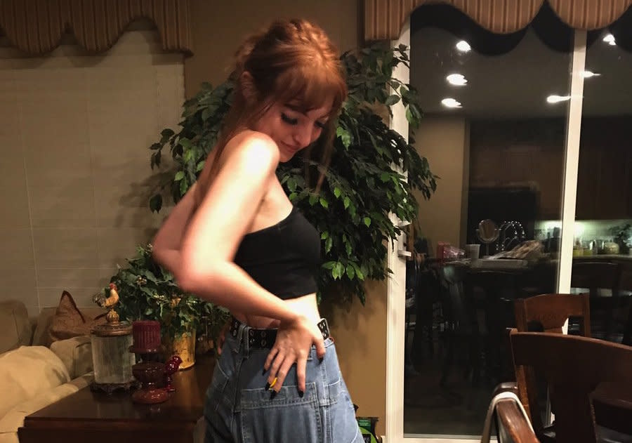 Remember JNCO Jeans? This girl just found the perfect use for hers — to carry her dog