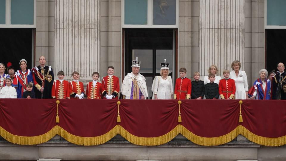 Members of the British royal family stands on the balcony with King Charles III and Queen Consort Camilla after the king's coronation.