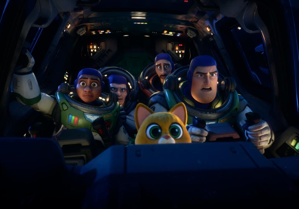 Buzz Lightyear (voiced by Chris Evans, right) leads a mission with wannabe space rangers (Keke Palmer, Dale Soules and Taika Waititi) and his feline robot companion Sox in Pixar's "Lightyear."