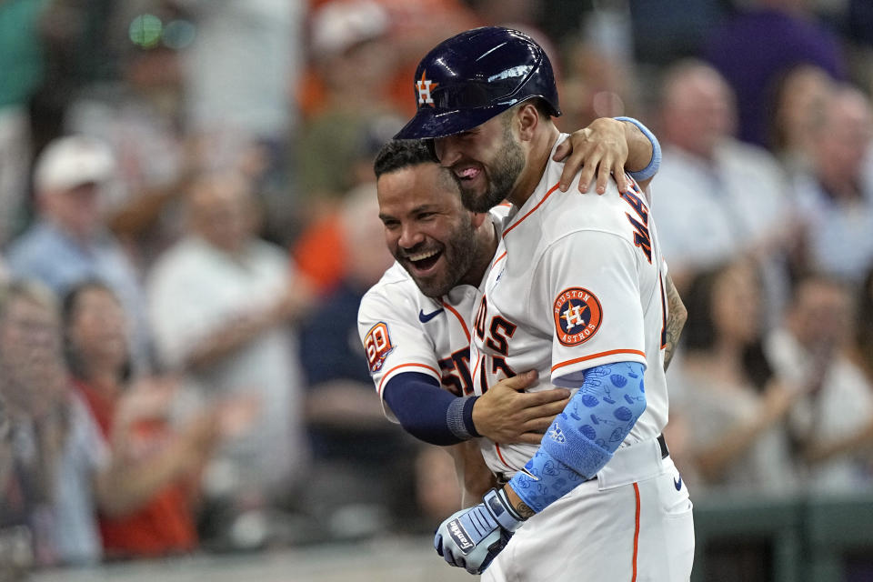 Houston Astros' J.J. Matijevic, right, celebrates with Jose Altuve after hitting a home run against the Chicago White Sox during the fourth inning of a baseball game Sunday, June 19, 2022, in Houston. Matijevic's home run was his first Major League hit. (AP Photo/David J. Phillip)