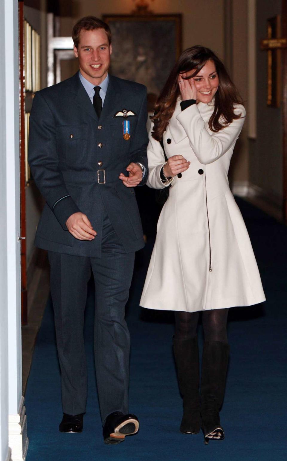 Prince William walks with his girlfriend Kate Middleton after his graduation ceremony at RAF Cranwell on April 11, 2008 in Cranwell, England