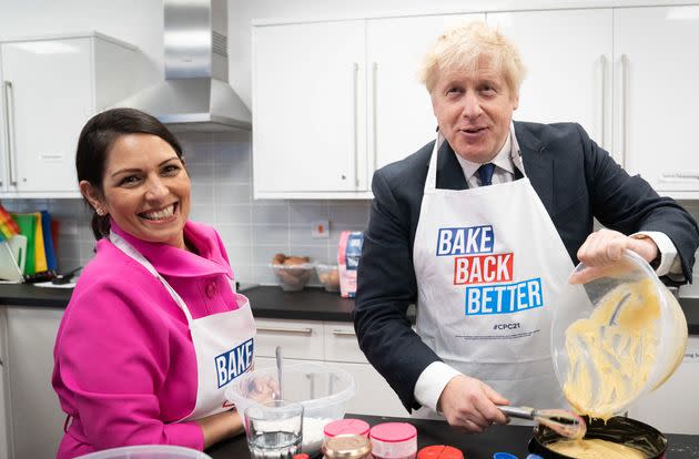 Priti Patel and Boris Johnson. (Photo: STEFAN ROUSSEAU via Getty Images)