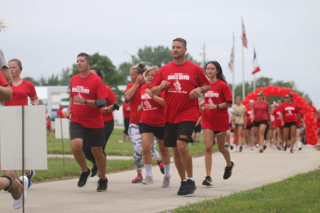 Participants take off at the start of the second annual Charlie Brewer Memorial Fun Run on Saturday, July 16, 2022, in Woodward.