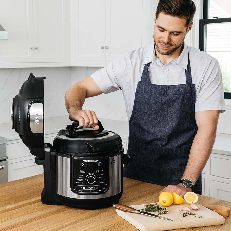 Man with Ninja Foodi in kitchen. (Photo: Amazon)