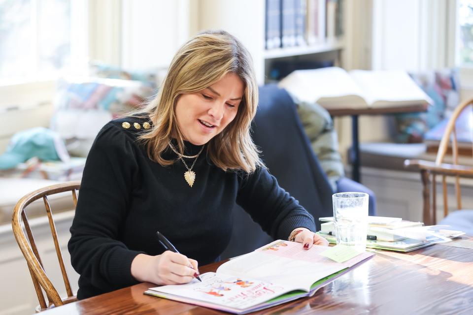 Jenna Bush Hager signs a copy of her new children's book, "Love Comes First," for a fan at the Louis T. Graves Memorial Public Library in Kennebunkport, Maine, on Saturday, Dec. 9, 2023. Hager and her twin sister, Barbara Pierce Bush, left, co-authored the book, which celebrates the bond between sisters and families.