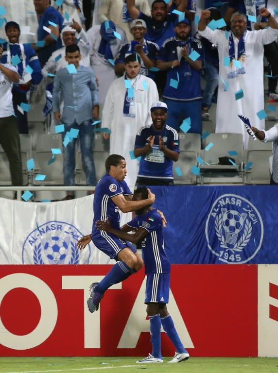 Al-Nasr's forward Wanderley celebrates his opening goal with teammate Jonathan Pitroipa during the Asian Champions League quarter-final football match between Qatar's El-Jaish and UAE's Al-Nasr in Doha on August 24, 2016