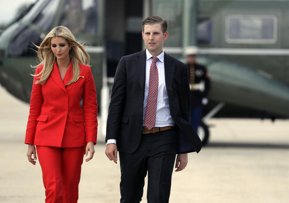 Ivanka Trump wore a red Sandro suit as she joined brother Eric for the Florida trip. (Photo: AP Photo/Evan Vucci)