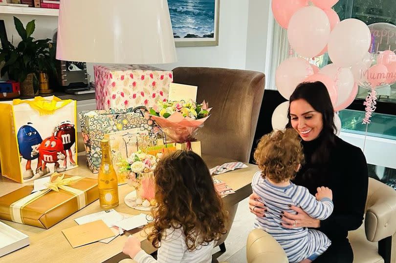 Christine Lampard sitting in her kitchen area