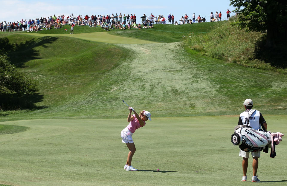 KOHLER, WI - JULY 08: Paula Creamer hits her second shot on the first hole as her caddie Colin Cann looks on during the final round of the 2012 U.S. Women's Open on July 8, 2012 at Blackwolf Run in Kohler, Wisconsin. (Photo by Scott Halleran/Getty Images)