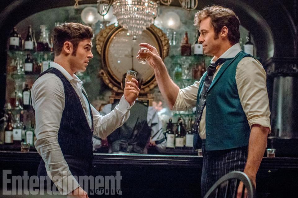 Here's to a hit musical: Zac Efron and Hugh Jackman in 'The Greatest Showman' (credit: 20th Century Fox/EW)