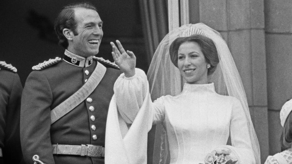 Princess Anne and Mark Phillips pose on the balcony of Buckingham Palace