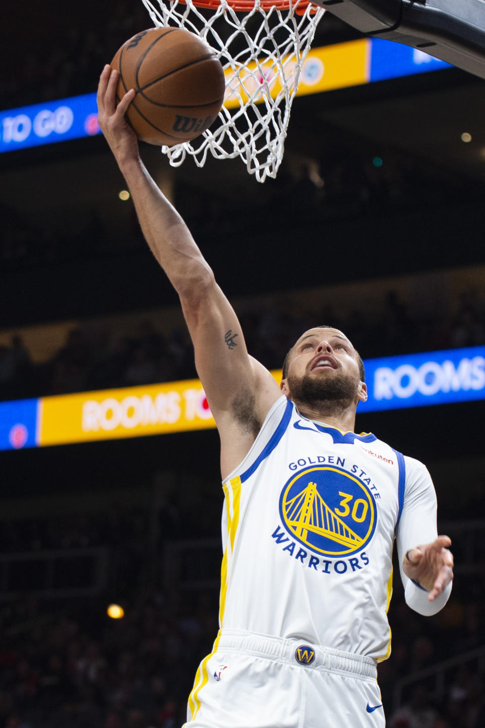 Golden State Warriors guard Stephen Curry scores during the first half of an NBA basketball game against the Atlanta Hawks, Friday, March 17, 2023, in Atlanta. (AP Photo/Hakim Wright Sr.)