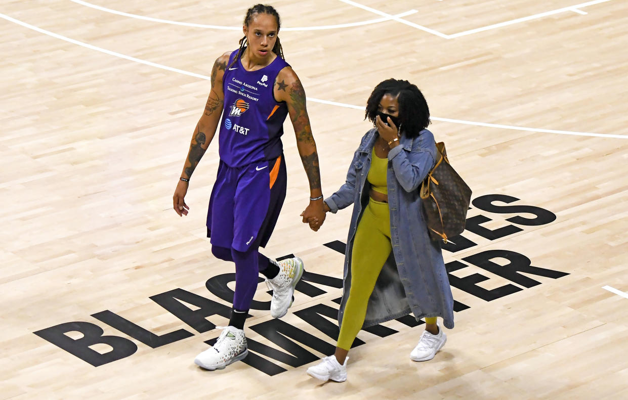 Brittney Griner (#42) of the Phoenix Mercury with wife Cherelle Watson  (Douglas P. DeFelice / Getty Images)