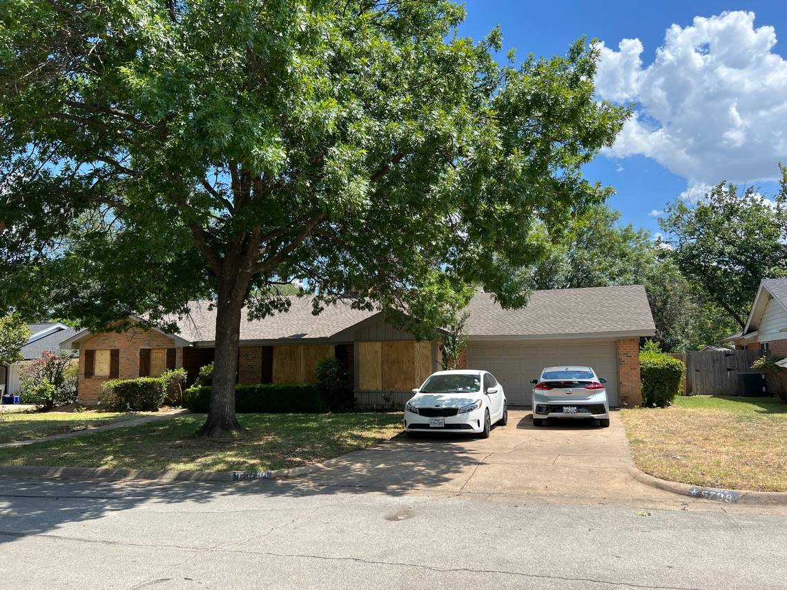 A man and a woman were shot and killed at this house in Haltom City before the gunman opened fire on responding police officers Saturday, July 2, 2022, police said. The windows were boarded up after the shooting.