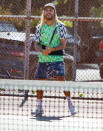 <p>Pete Wentz is all smiles while playing tennis with friends at a local park on Wednesday in L.A. </p>