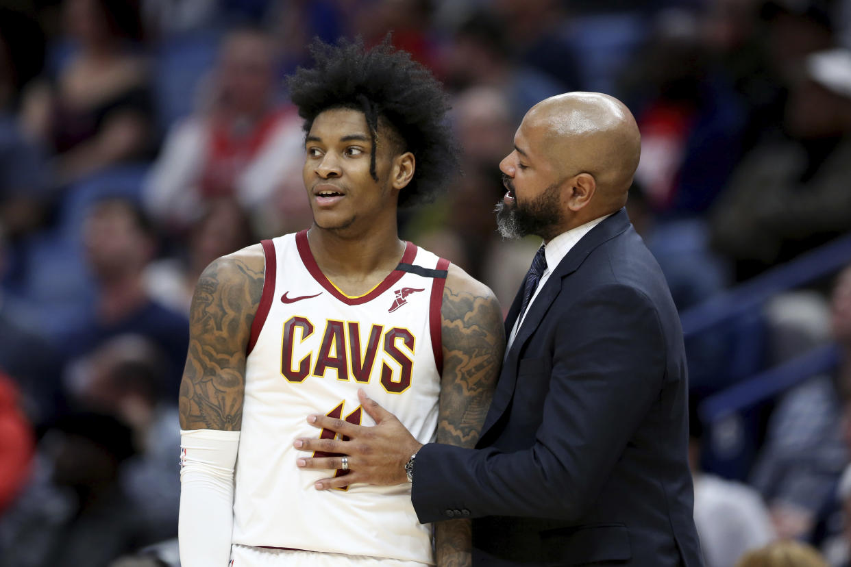 Kevin Porter Jr. in a Cavaliers jersey and J.B. Bickerstaff 