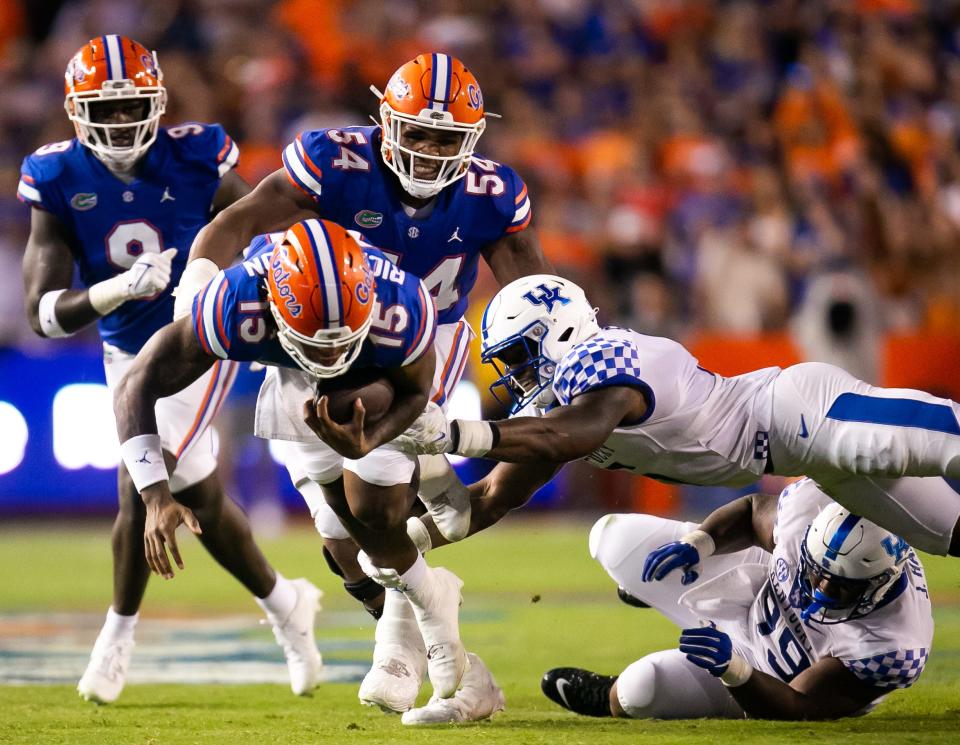 Florida Gators quarterback Anthony Richardson (15) tries to elude a Wildcats defender in the first half at Steve Spurrier Field at Ben Hill Griffin Stadium in Gainesville, FL on Saturday, September 10, 2022. [Doug Engle/Gainesville Sun]