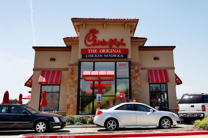 Drive through customers wait in line at a Chick-fil-A restaurant on August 1, 2012 in Fort Worth, Texas.