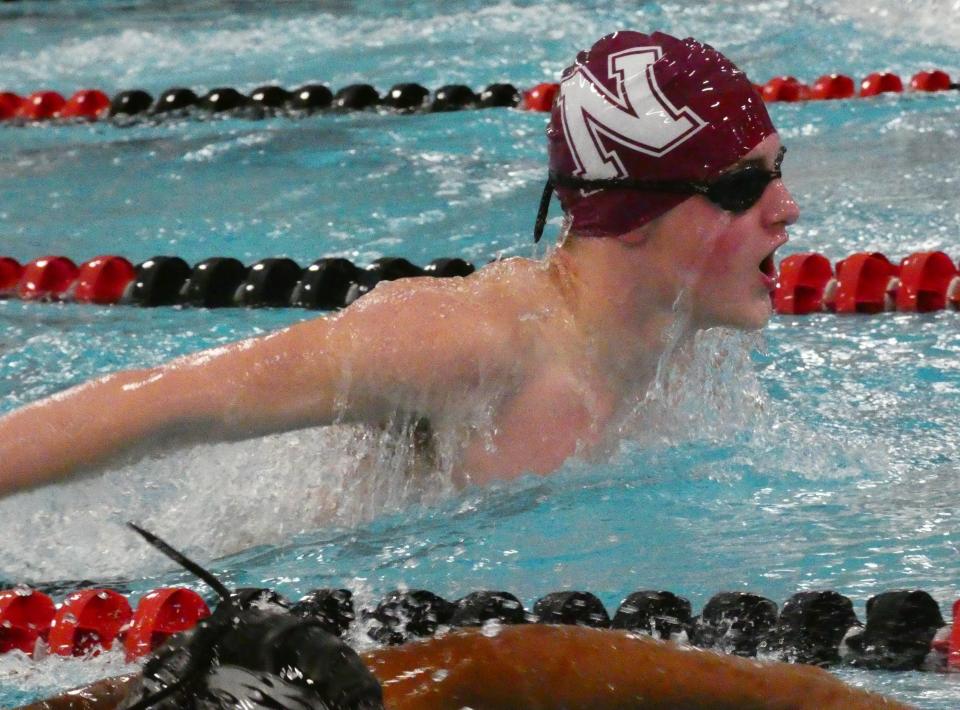Newark sophomore Ben Hammond swims in the 100 butterfly during a meet against Lakewood, Central Crossing and West Muskingum at the Licking County Family YMCA on Friday, Jan. 14, 2022.