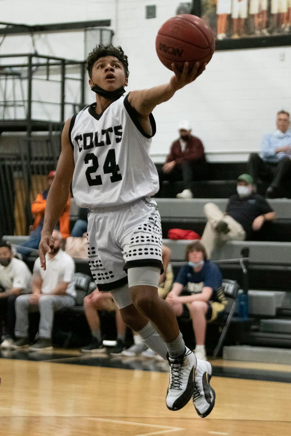South High School's Maurice Austin floats in for a layup during the game against Palmer Ridge on Thursday, December 9, 2021.