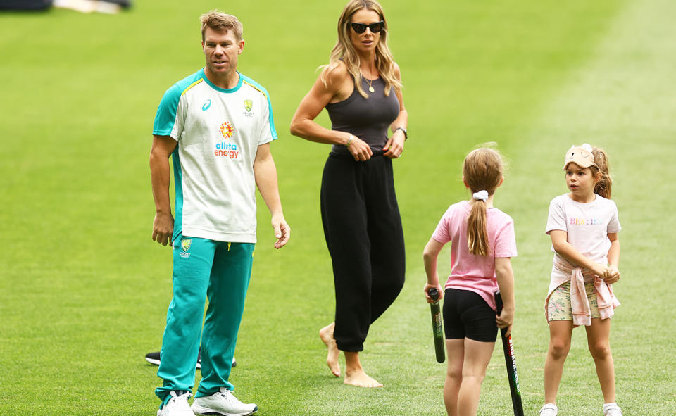 David Warner, pictured here with wife Candice and their daughters at the MCG in 2021.