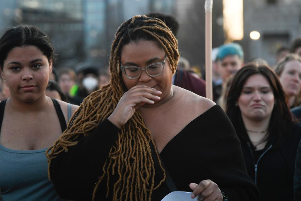 Noelle Johnson participates in a Mourners Walk to honor Tennessee victims of gun violence in the past year as they march Wednesday, March 29, 2023 in Nashville, Tenn.