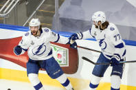 Tampa Bay Lightning's Brayden Point (21) celebrates his goal against the Dallas Stars with Victor Hedman (77) during first-period NHL Stanley Cup finals hockey game action in Edmonton, Alberta, Monday, Sept. 28, 2020. (Jason Franson/The Canadian Press via AP)