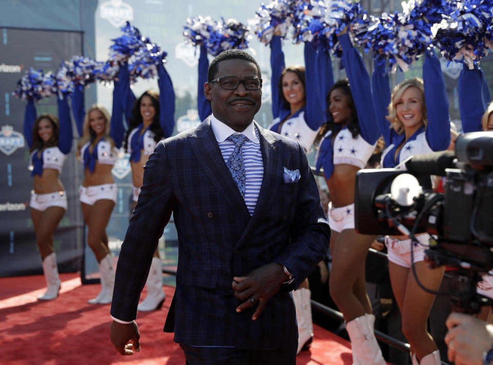 <p>Broadcast analyst and Hall of Famer Michael Irvin walks the red carpet before the first round of the 2018 NFL football draft, Thursday, April 26, 2018, in Arlington, Texas. (AP Photo/Eric Gay) </p>