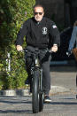 <p>Days after donating $1 million to frontline responders of the coronavirus crisis, Arnold Schwarzenegger goes for a bike ride around his neighborhood in L.A. on Wednesday.</p>