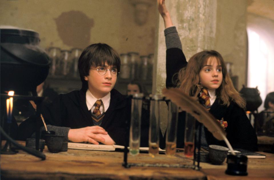 Daniel Radcliffe, left, and Emma Watson in a scene from the motion picture "Harry Potter and the Sorcerer's Stone."