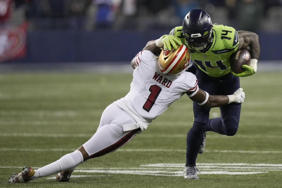 Seattle Seahawks wide receiver DK Metcalf (14) runs against San Francisco 49ers cornerback Jimmie Ward (1) during the second half of an NFL football game in Seattle, Thursday, Dec. 15, 2022. (AP Photo/Stephen Brashear)