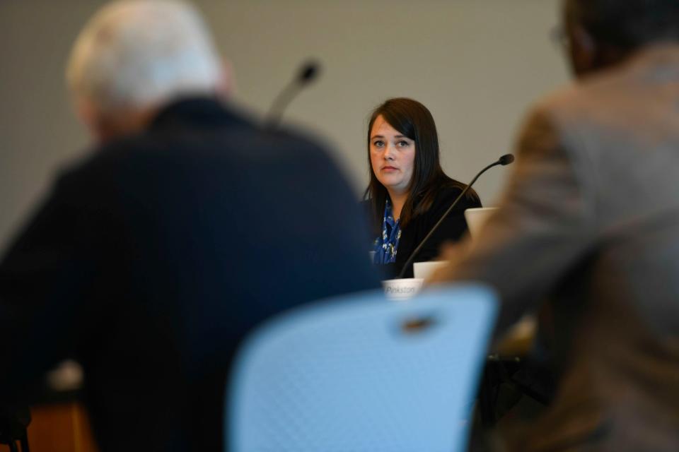 Elizabeth Collins, on the Greenville Public Library board of trustees, listens on as the board discusses the issue of library displays during a board meeting on Friday Oct. 13, 2023.