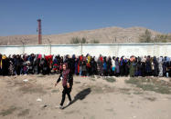 Afghan women line up to cast their votes during the parliamentary election at a polling station in Kabul, Afghanistan October 21, 2018. REUTERS/Omar Sobhani