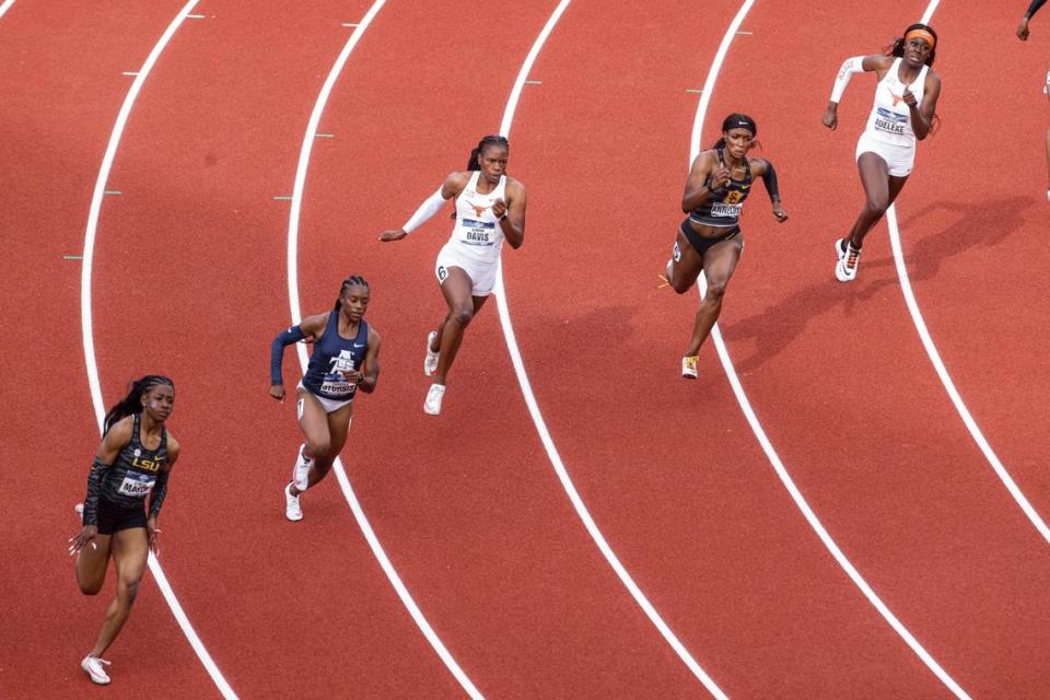 Runners compete in a preliminary heat of the women’s 200 meters during the NCAA Division I Outdoor Track and Field Championships, Thursday, June 10, 2021, at Hayward Field in Eugene, Ore. From left are LSU’s Symone Mason, North Carolina A&T’s Cambrea Sturgis, Texas’ Kevona Davis, Southern California’s Anglerne Annelus and Texas’ Rhasidat Adeleke. (AP Photo/Thomas Boyd)