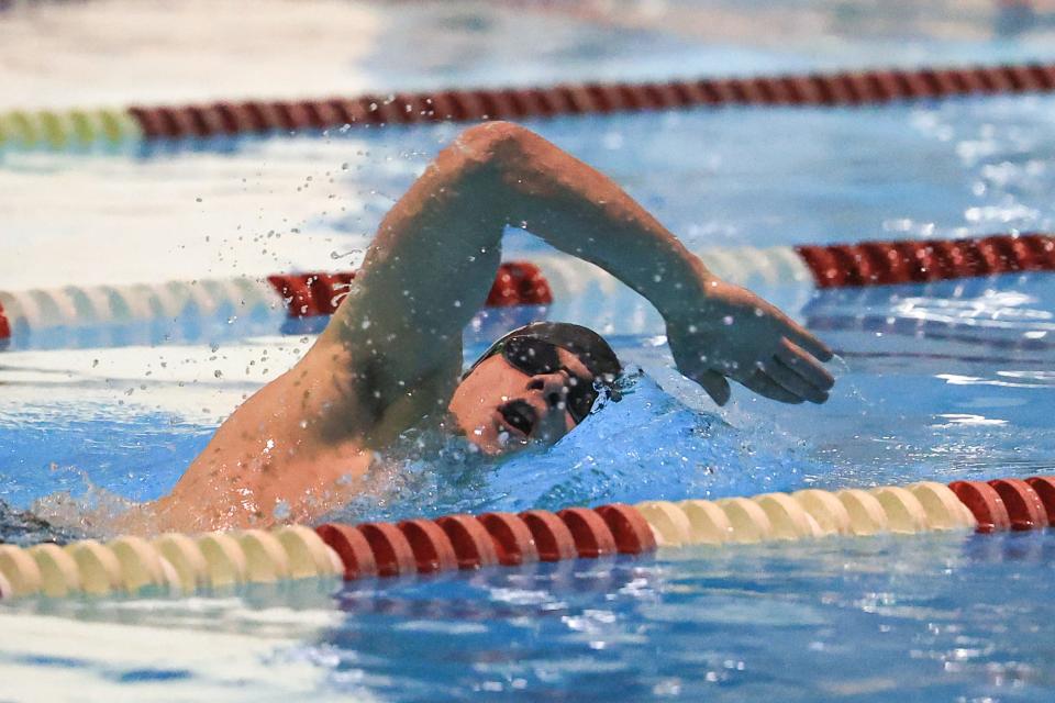 Aurora’s Nate New swims to a first place finish in the Boys 200 Yard Freestyle event during a meet against Kent Roosevelt High School Monday, January 10 at the Kent Roosevelt Natatorium.