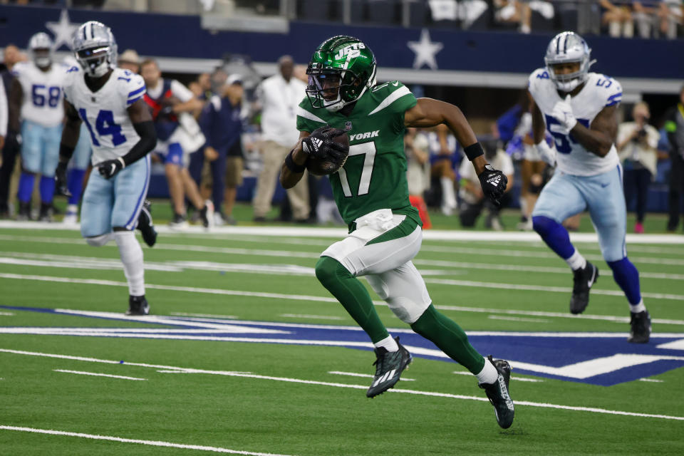 New York Jets wide receiver Garrett Wilson runs for a touchdown against the Dallas Cowboys during the first half of an NFL football game in Arlington, Texas, Sunday, Aug. 17, 2023. (AP Photo/Michael Ainsworth)