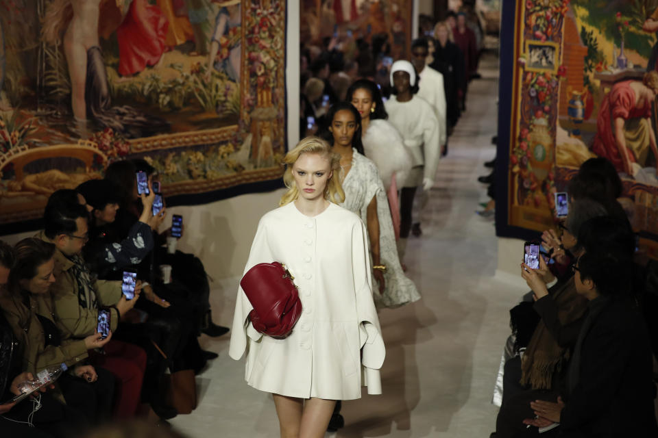 Models wear creations for the Lanvin fashion collection during the Women's fashion week Fall/Winter 2020/21 presented in Paris, Wednesday, Feb. 26, 2020. (AP Photo/Francois Mori)