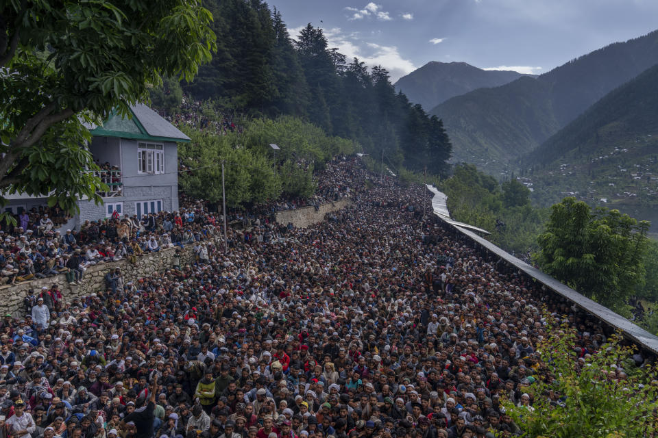 Kashmiri devotees belonging to nomadic Gujjar tribe pray at a forest shrine of Sufi saint Mian Nizamuddin Kiyanwi in Baba Nagri, northeast of Srinagar, Indian controlled Kashmir, Saturday, June 8, 2024. (AP Photo/Dar Yasin)