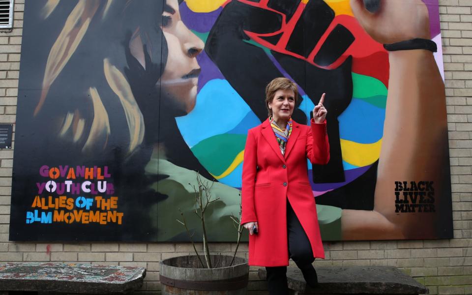 First Minister and leader of the Scottish National Party (SNP) Nicola Sturgeon beside a Black Lives Matters mural in Glasgow - Pool/ Getty Images Europe