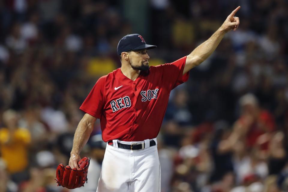 Boston Red Sox's Nathan Eovaldi signals after New York Yankees' Gleyber Torres lined out to Enrique Hernandez to end the top of the seventh inning during a baseball game, Saturday, June 26, 2021, in Boston. (AP Photo/Michael Dwyer)