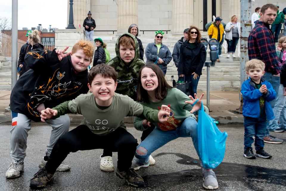 Spectators outside of the Erie Art Museum, on March 19, 2022, attend the first St. PatrickÕs Day parade since the COVID pandemic began in March 2020. SaturdayÕs parade took place, despite scattered showers, along State Street in Erie. Originally scheduled for March 12, the parade was postponed due to winter weather. Several hundred people were in attendance as the parade marched north on State Street from 11th Street.