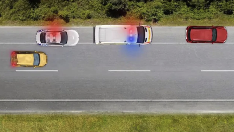 NSW drivers will be obliged to create as much space as possible. An image of a car passing two emergency services vehicles.