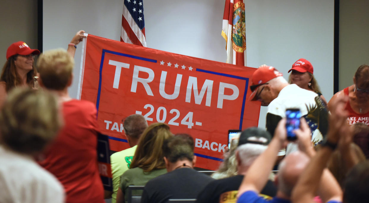 People hold a Trump 2024 flag before U.S. Rep. Matt Gaetz (R-FL) who arrives to address supporters at a Matt Gaetz Florida Man Freedom Tour event at the Hilton Melbourne Beach. (Paul Hennessy/SOPA Images/LightRocket via Getty Images)