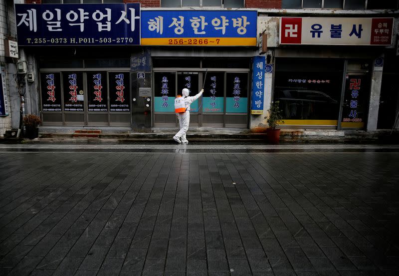 South Korean solider sprays disinfectant at the herbal medicine market street amid the rise in confirmed cases of COVID-19 in Daegu