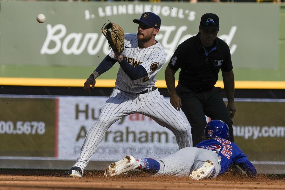 Chicago Cubs' Pete Crow-Armstrong steals second with Milwaukee Brewers' Brice Turang covering during the fifth inning of a baseball game Sunday, Oct. 1, 2023, in Milwaukee. (AP Photo/Morry Gash)