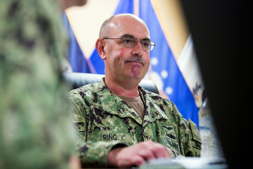 In this Wednesday, April 17, 2019, file photo reviewed by U.S. military officials, U.S. Navy Rear Adm. John Ring, Joint Task Force Guantanamo Commander, pauses while speaking during a roundtable discussion with the media, at Guantanamo Bay Naval Base, Cuba. Military officials say that Ring has been fired for a “loss of confidence in his ability to command.” A statement from U.S. Southern Command says Ring was relieved of duty Saturday, April 27.