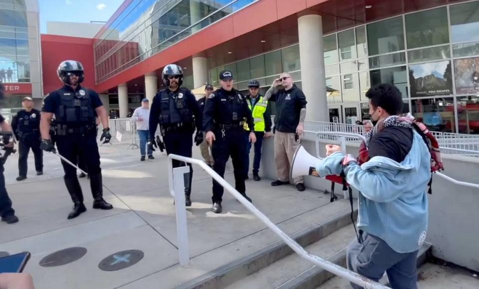 Cal Poly student Samir Ibrahim yells at officers outside the Cal Poly Rec Center after they told pro-Palestine protesters to leave following a clash between police and pro-Palestine demonstrators on Tuesday, Jan. 23, 2024.